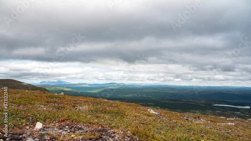 Mountain timelapse on a cloudy summer day in Sweden. photo
