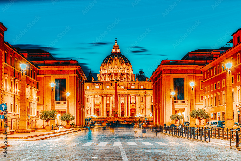 St. Peter's Square and St. Peter's Basilica, Vatican City in the evening time from street Conciliazione (Via della Conciliazione ).