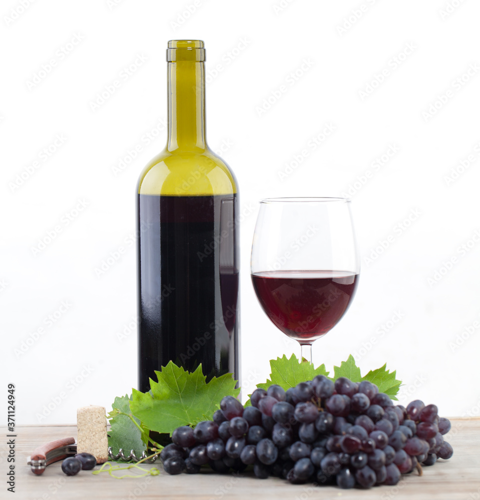 Red wine bottle and grape on white background