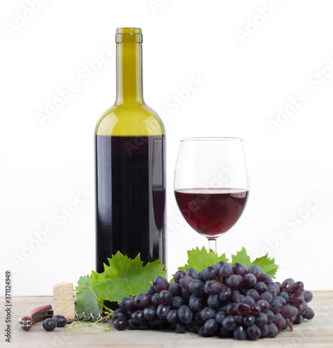 Red wine bottle and grape on white background