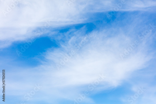 White clouds on a blue sky as background