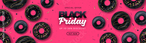 Black friday big sale poster with black sweet donuts on pink background