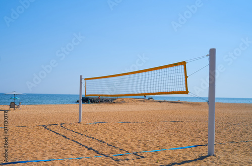 beach volleyball net hanging by the sea