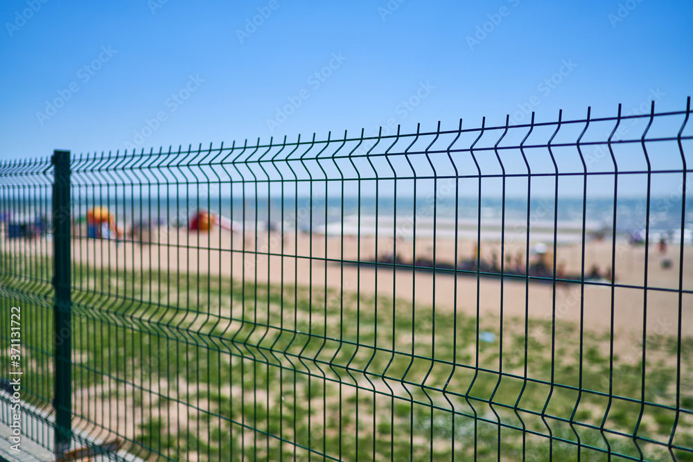 beach shoreline iron fence