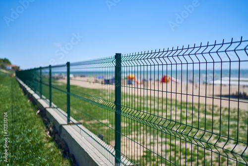 beach shoreline iron fence