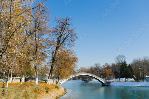 Tashkent, Uzbekistan. December 2019. Reservoir (Komsomol lake) in the national Park of Uzbekistan in winter and a bridge over the lake photo