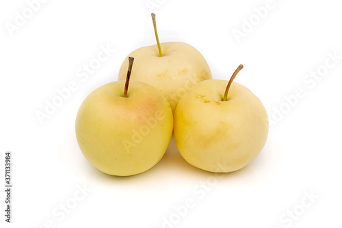 Yellow mini apples isolated on white background.