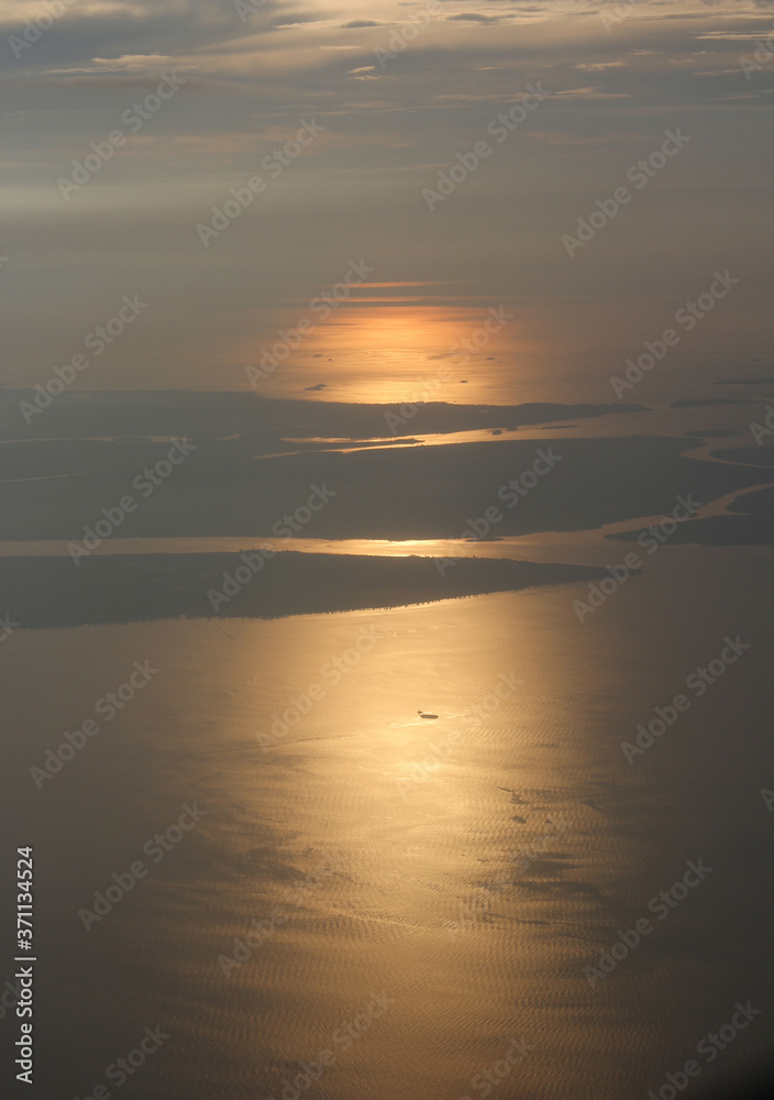 View of earth during sunset from airplane
