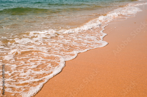 Tourist travel banner design template  copy space. White foam of a sea wave  golden sand beach  turquoise ocean water.