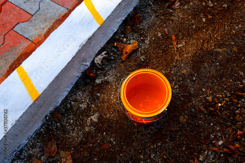 top view of yellow color paint can isolated on ground