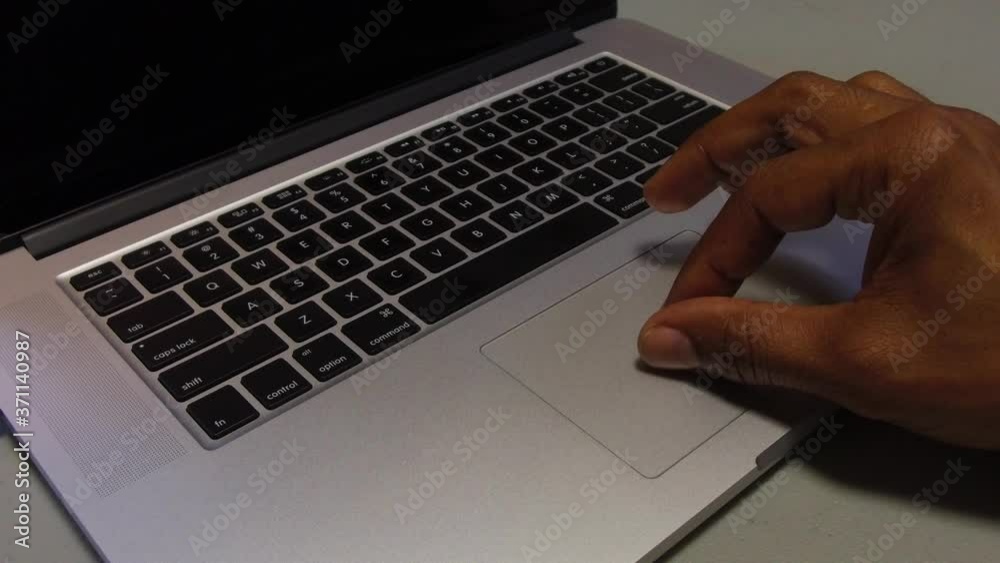 Man Using A MacBook Laptop - Pinch Zoom Gesture