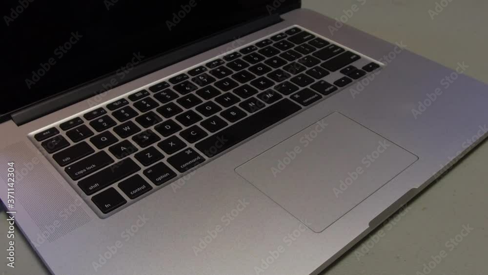 Man Using A MacBook Laptop - Pinch Out Gesture Man Using A MacBook Laptop - Pinch Out Gesture