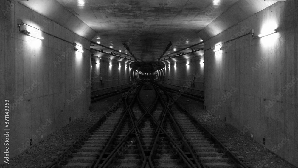 Fototapeta premium Crossover rail lines in subway tunnel