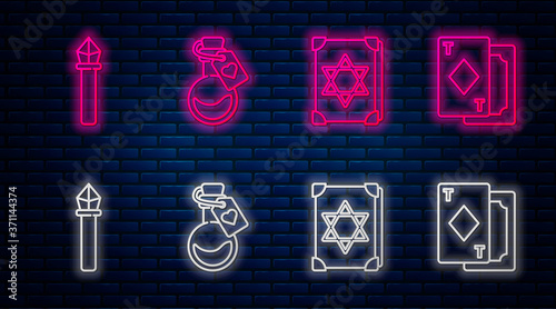 Set line Bottle with love potion, Ancient magic book, Magic staff and Playing cards. Glowing neon icon on brick wall. Vector.