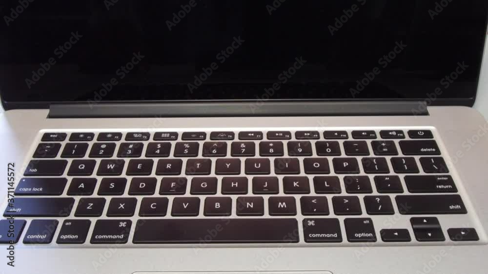 4333 - Man Typing the Letter J on Laptop Computer