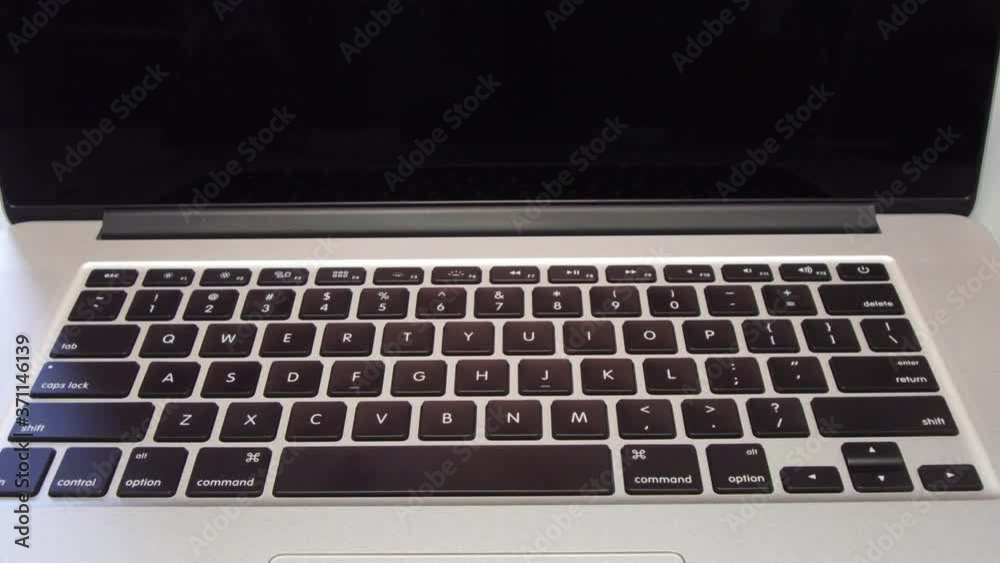 4336 - Man Typing the Letter M Key on Laptop Computer