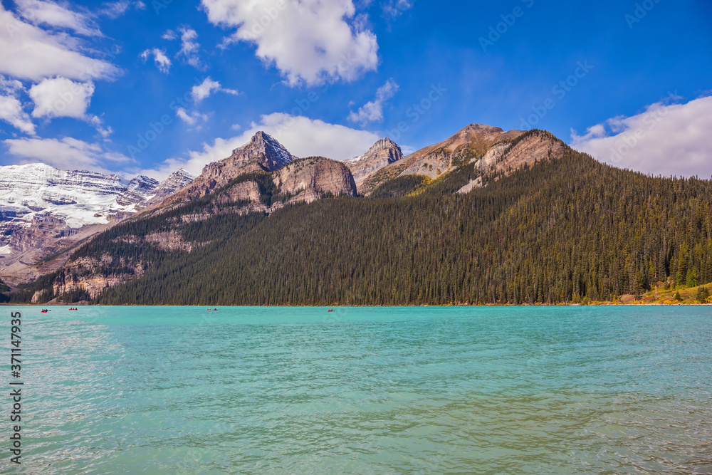 Magnificent Lake Louise, pine forests and glaciers
