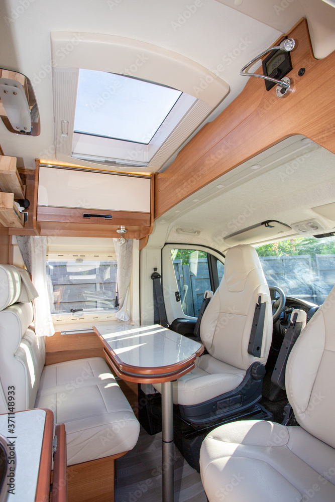 camper van modern white table and seat interior in luxury motorhome on rv  vanlife concept Stock Photo | Adobe Stock