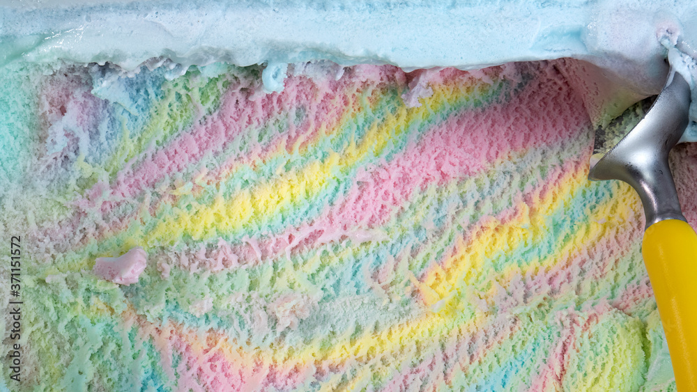 Rainbow colorful flavored ice cream scooped.
