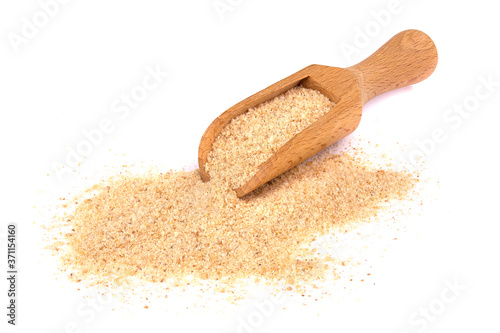 Schilderij op canvas Pile of breadcrumbs and spoon isolated on white