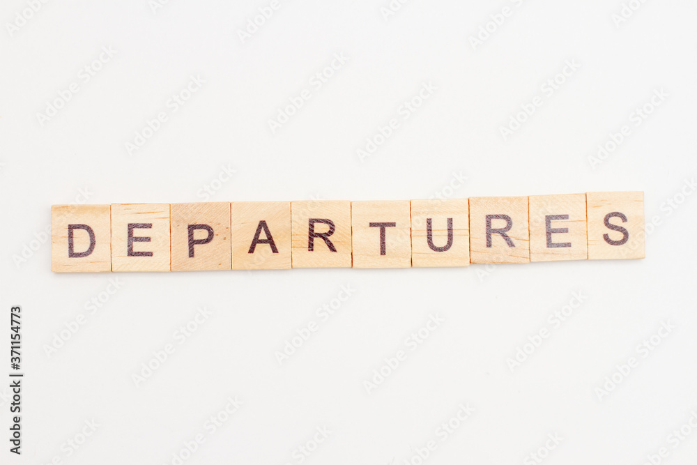 Word DEPARTURED made from wooden cubes on white. Travel concept Word DEPARTURED made from wooden cubes on white. Travel concept