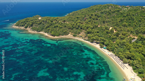 Aerial drone photo of beautiful sandy beach of Agia Eleni next to famous banana beach, Skiathos island, Sporades, Greece © aerial-drone