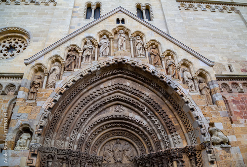 The ornate entrance to the 13th century Romanesque church in Jak, Hungary. photo