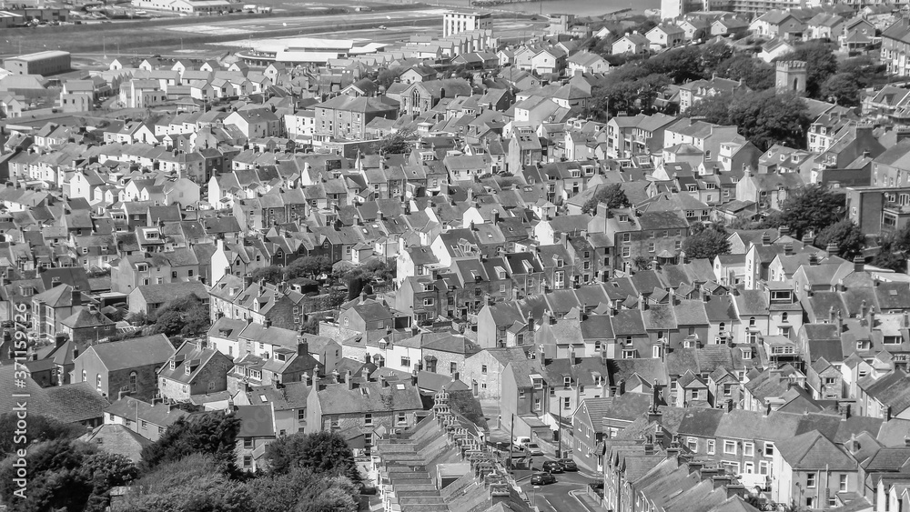 Isle of Portland, Dorset, England (UK) - 15th of May 2014: Panoramic view on high density housing in Fortuneswell village in black nad white tones