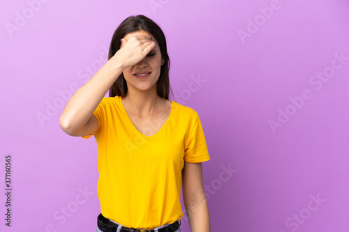 Young caucasian woman over isolated background with headache