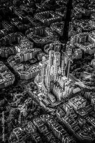 Photography Aerial view of typical buildings of Barcelona cityscape from helicopter with Sagrada Familia