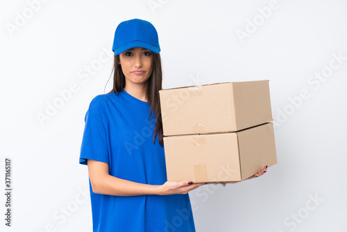 Young delivery woman over isolated white background pleading