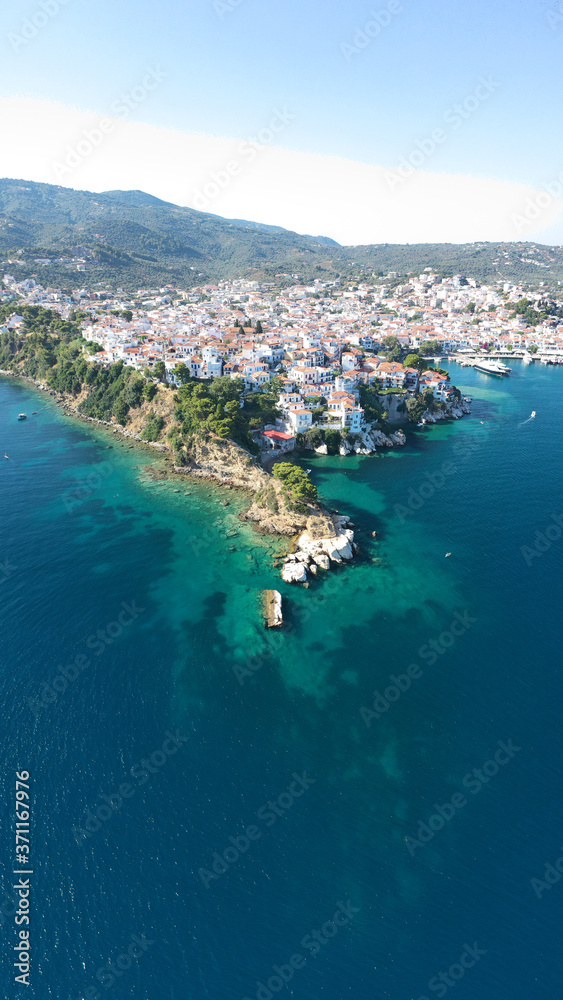 Aerial drone photo of picturesque small beach of Plakes in main village of Skiathos island, Sporades, Greece