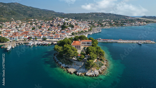 Aerial drone photo of amazing vegetated islet of Bourtzi built in small peninsula in port of Skiathos island main town hosting an old school  Sporades  Greece