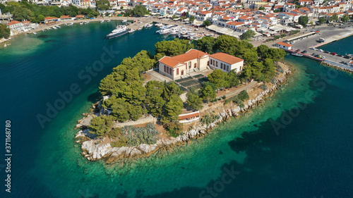 Aerial drone photo of amazing vegetated islet of Bourtzi built in small peninsula in port of Skiathos island main town hosting an old school, Sporades, Greece