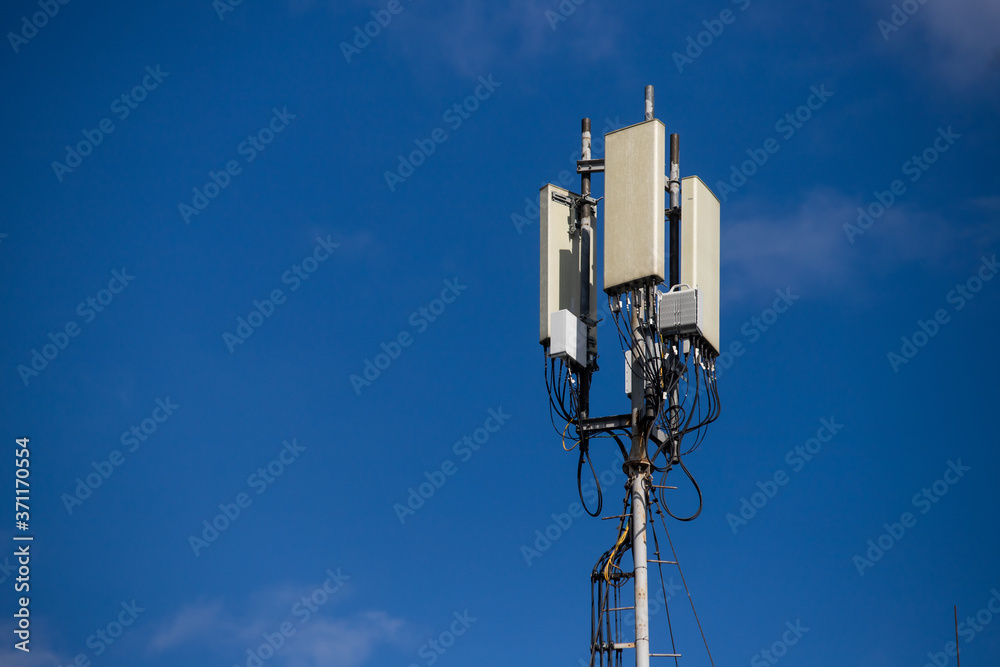 Telecommunication tower of 4G and 5G cellular. Macro Base Station. 5G radio network telecommunication equipment with radio modules and smart antennas mounted on a metal. Telecommunication tower of 4G and 5G cellular. Macro Base Station. 5G radio network telecommunication equipment with radio modules and smart antennas mounted on a metal.