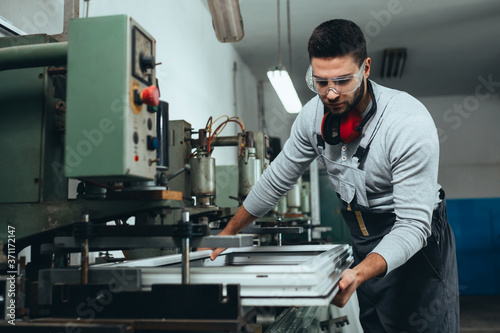 PVC industry worker making PVC frames for windows and doors