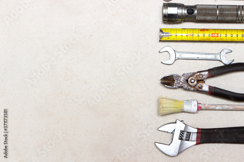 decorating and house renovation tools and other essentials on white background. flat lay composition