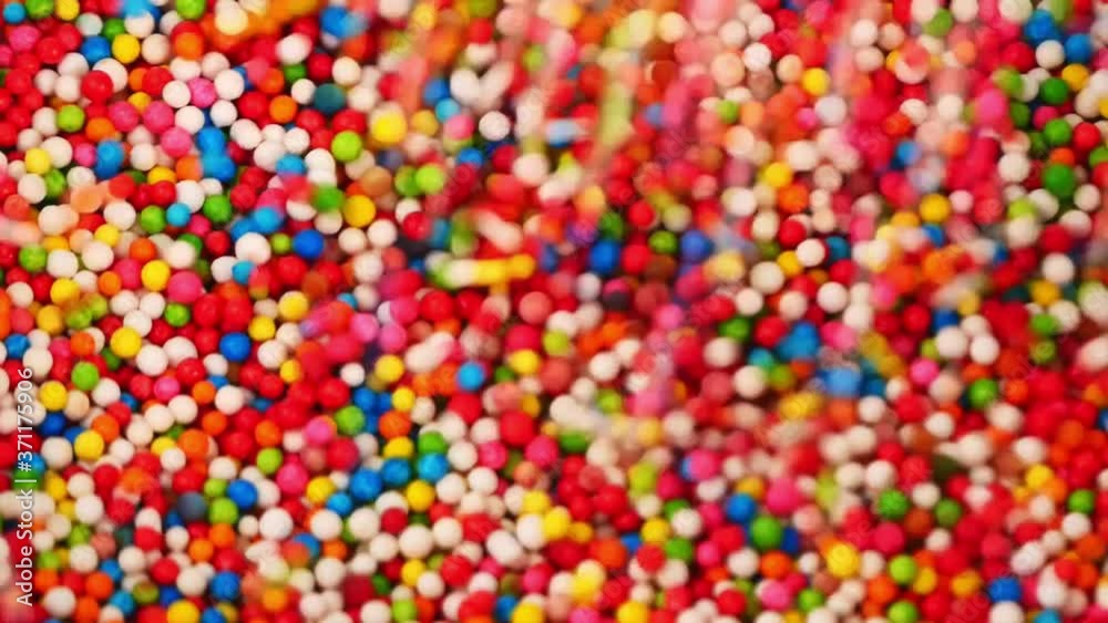 Sweet candy full many colors drop into clear cups, Food concept. Sweet candy full many colors drop into clear cups, Food concept.