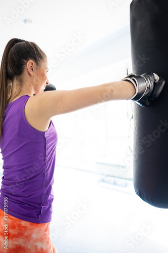 Pretty attractive woman kickboxing in gym © Jasmin Merdan