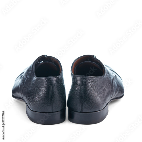 Light men's shoes made of thin black leather with lacing. Classic men's shoes. Rear view.