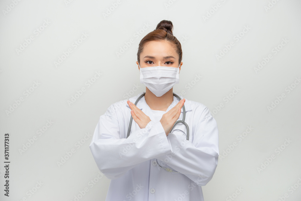 Serious-looking asian female doctor in medical mask, white coat make stop, cross sign, forbid coming outside Serious-looking asian female doctor in medical mask, white coat make stop, cross sign, forbid coming outside