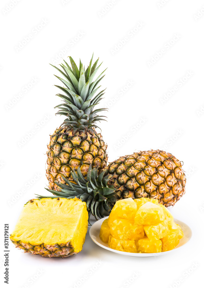 Sliced pineapple on a white plate, it is a sweet and juicy fruit.