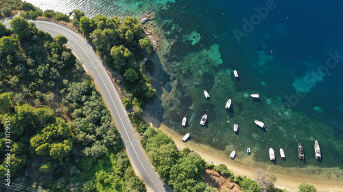 Aerial drone photo of famous seaside area and bay of Kanapitsa with many beautiful secluded sandy beaches, Skiathos island, Sporades, Greece