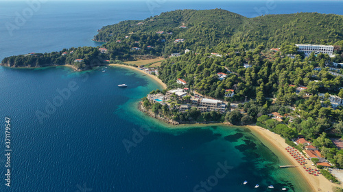 Aerial drone photo of famous seaside area and bay of Kanapitsa with many beautiful secluded sandy beaches, Skiathos island, Sporades, Greece © aerial-drone