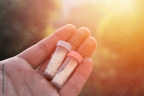 homeopathic medicine in hand