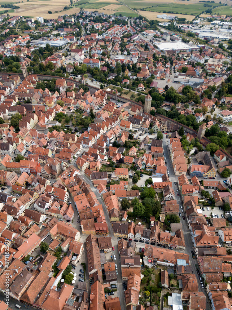 ROTHENBURG OB DER TAUBER / GERMANY - JULY 29 2018: Aerial view Rothenburg old town fairy tale german Bavarian city with half-tembered medieval architecture Old street brown roofs houses cityscape.
