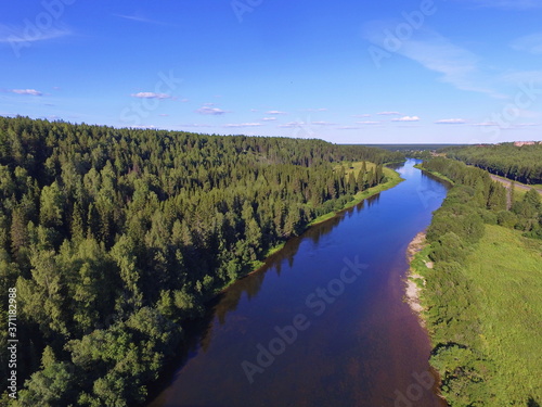 Ukhta river and blue sky, Komi Republic, Russia. photo