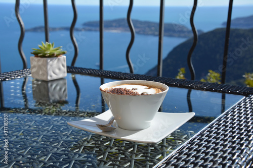 Cappuccino coffee with scenic sea view in Eze village, France. photo