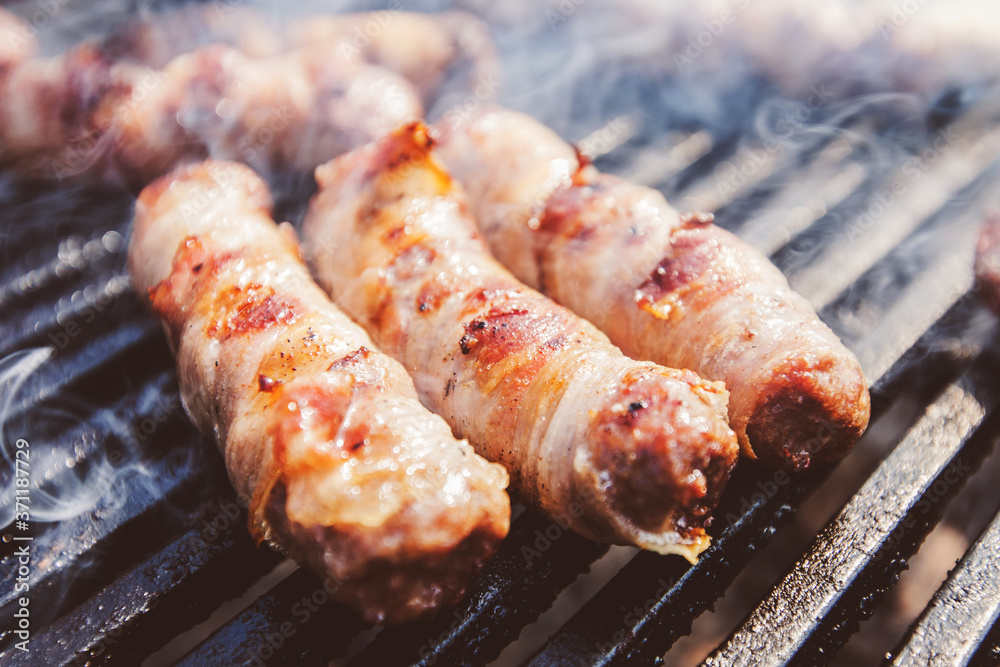 Delicious rolled meat with bacon on BBQ party