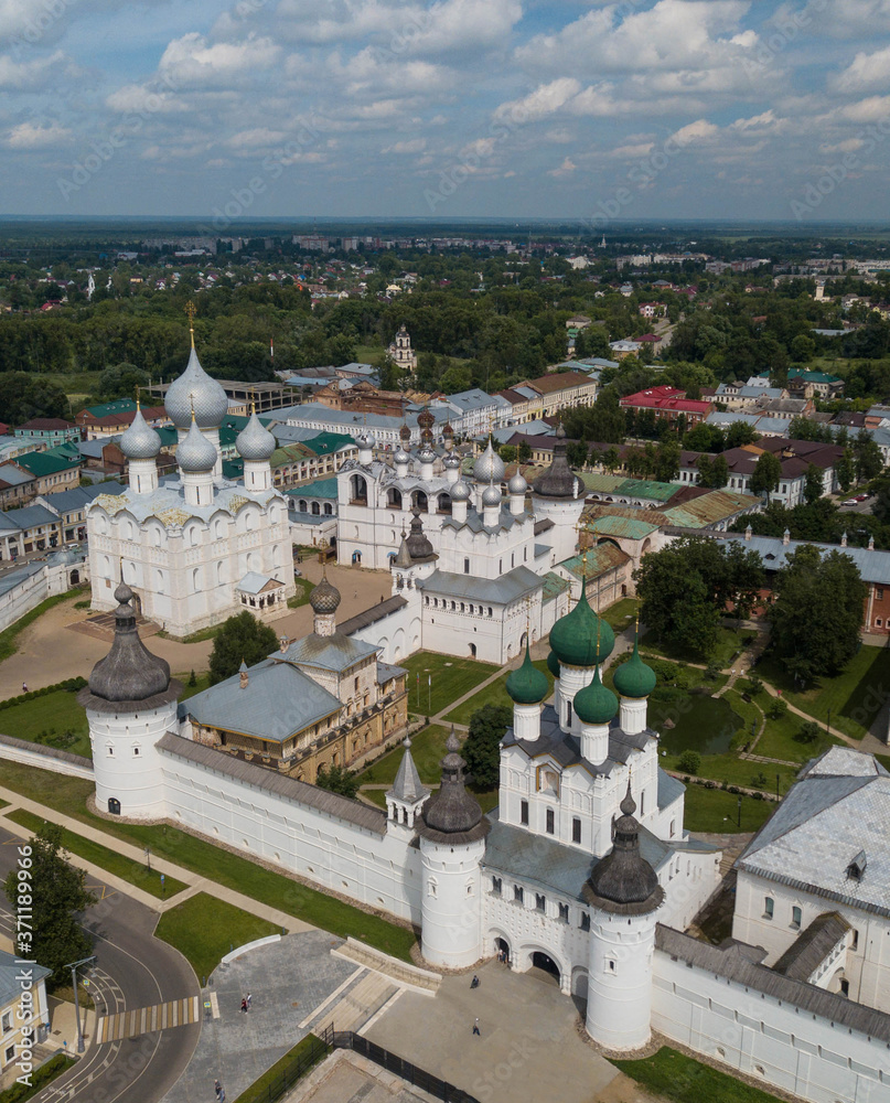 Aerial summer view of white old monastery with silver domes in Rostov the Great city. Russia